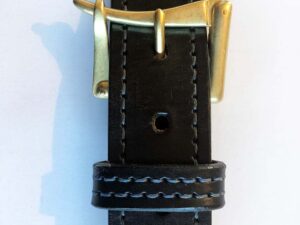 Black leather belt asymmetric brass buckle design