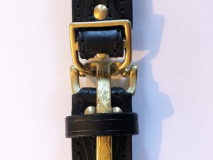 Black leather belt, ornate brass buckle